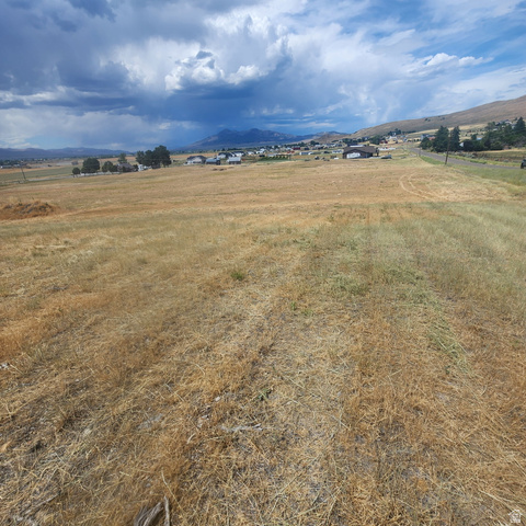 13363 North 3100th Street West, Unit R1 A Collinston, UT 84306 - Photo 16 of 20 Expansive land featuring a rural landscape and beautiful mountain ranges.