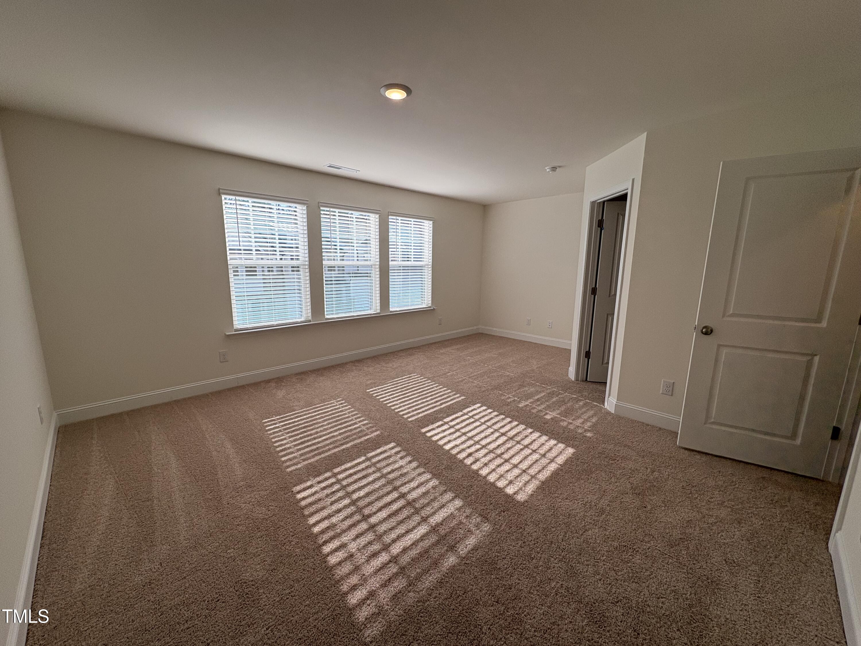 6316 Granite Quarry Drive Raleigh, NC 27610 - Photo 11 of 16 a view of an empty room with a window
