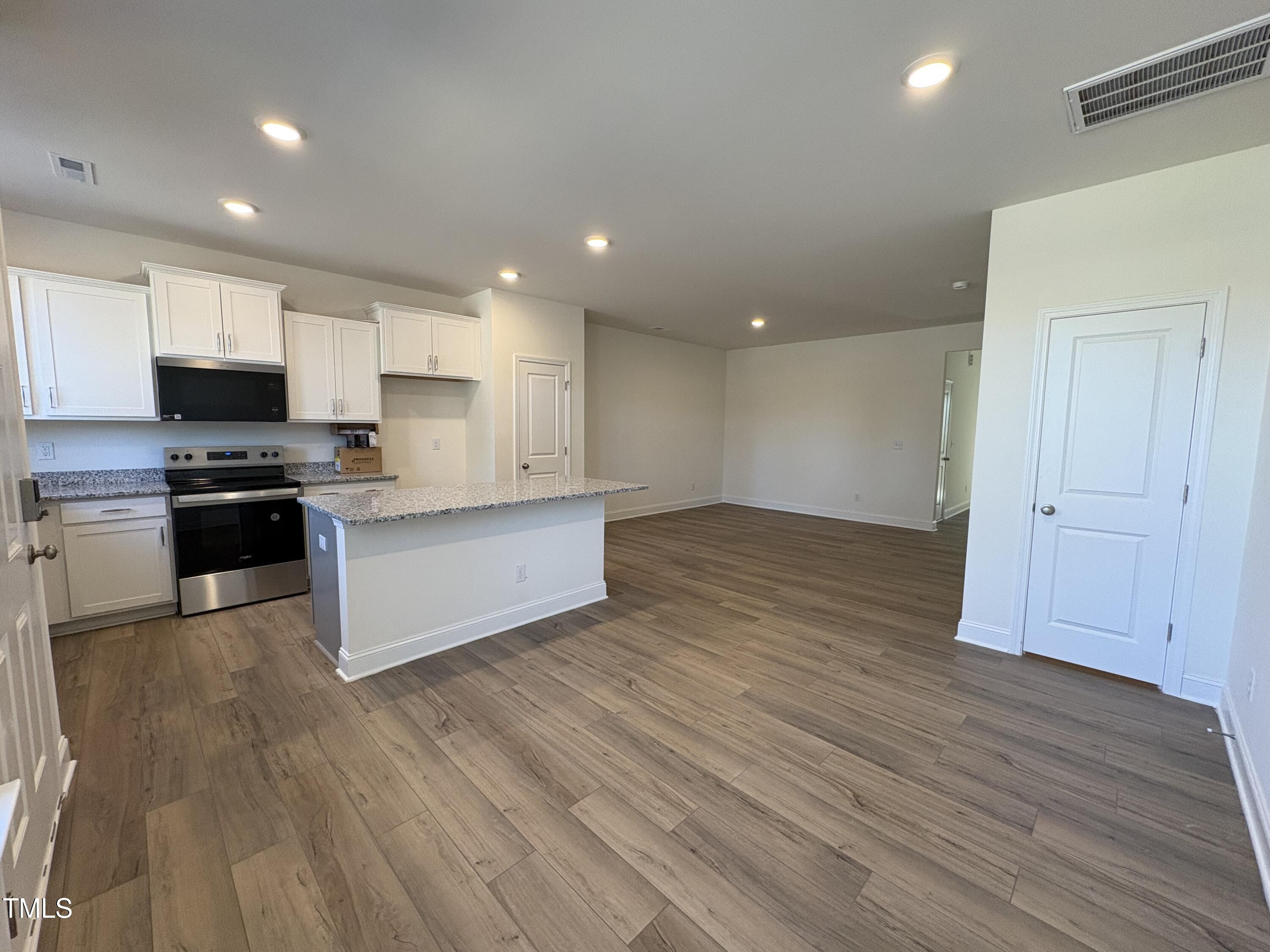 6316 Granite Quarry Drive Raleigh, NC 27610 - Photo 3 of 16 a view of kitchen with microwave and cabinets