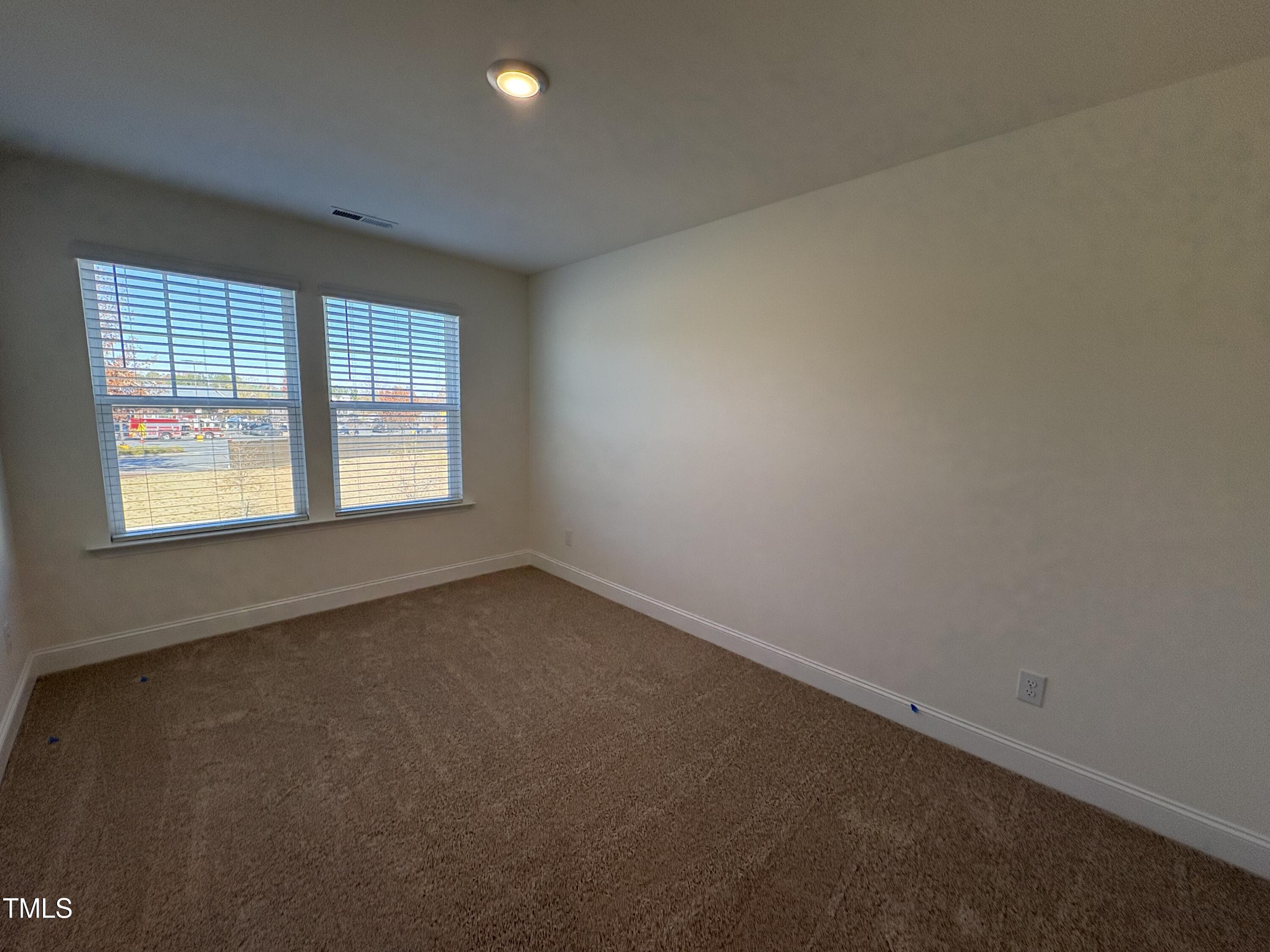 6316 Granite Quarry Drive Raleigh, NC 27610 - Photo 9 of 16 an empty room with a window