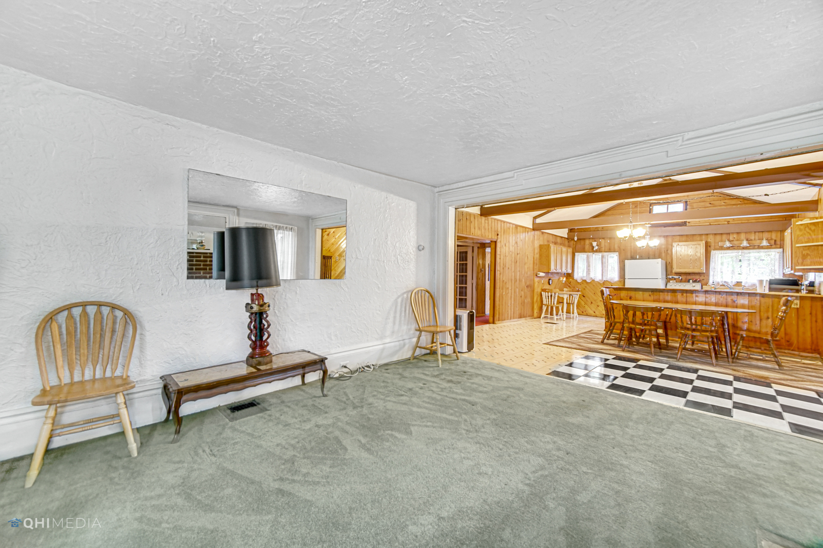 275 West Richton Road Steger, IL 60475 - Photo 11 of 35 a living room with furniture a flat screen tv and floor to ceiling window