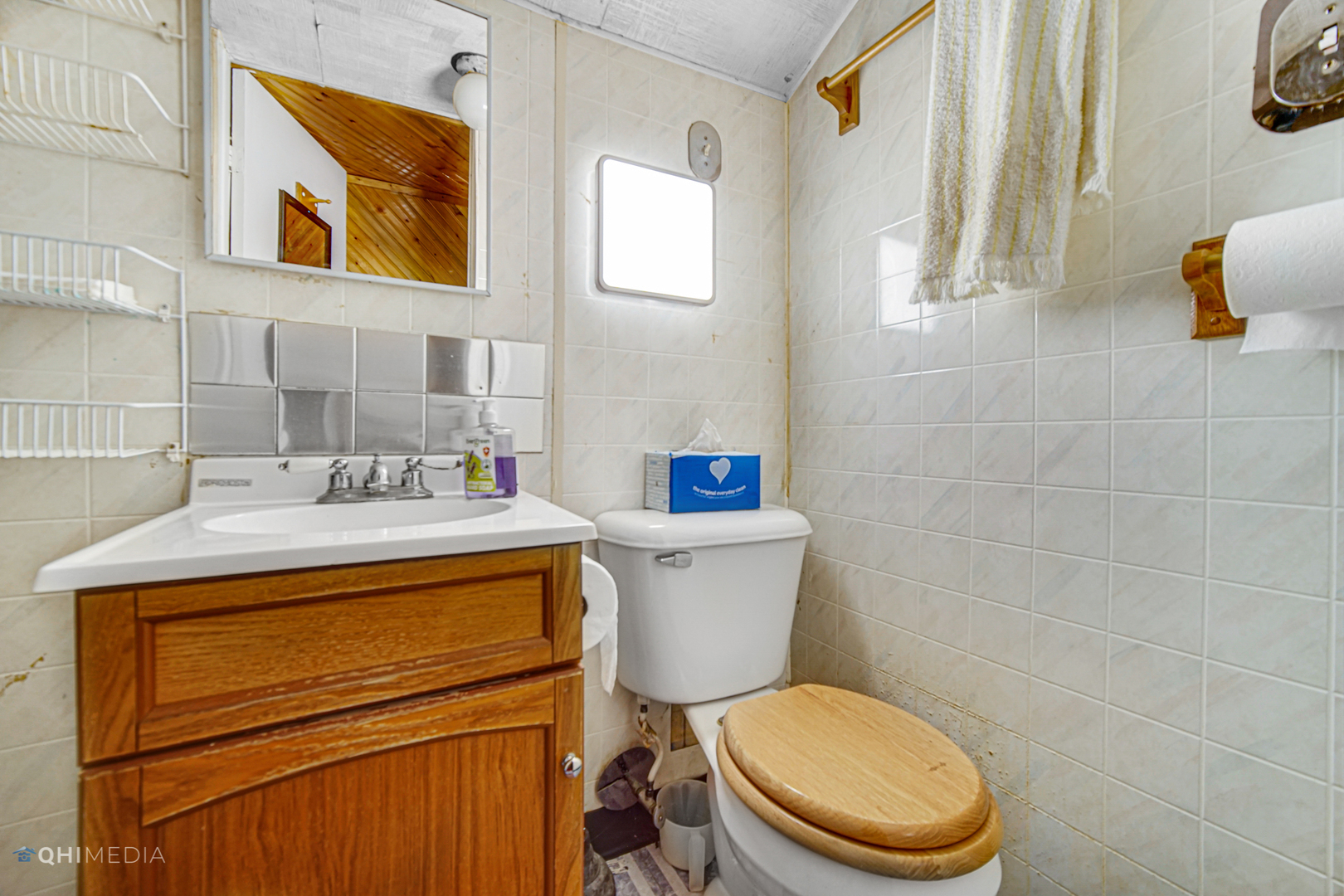 275 West Richton Road Steger, IL 60475 - Photo 24 of 35 a bathroom with a toilet a sink and mirror