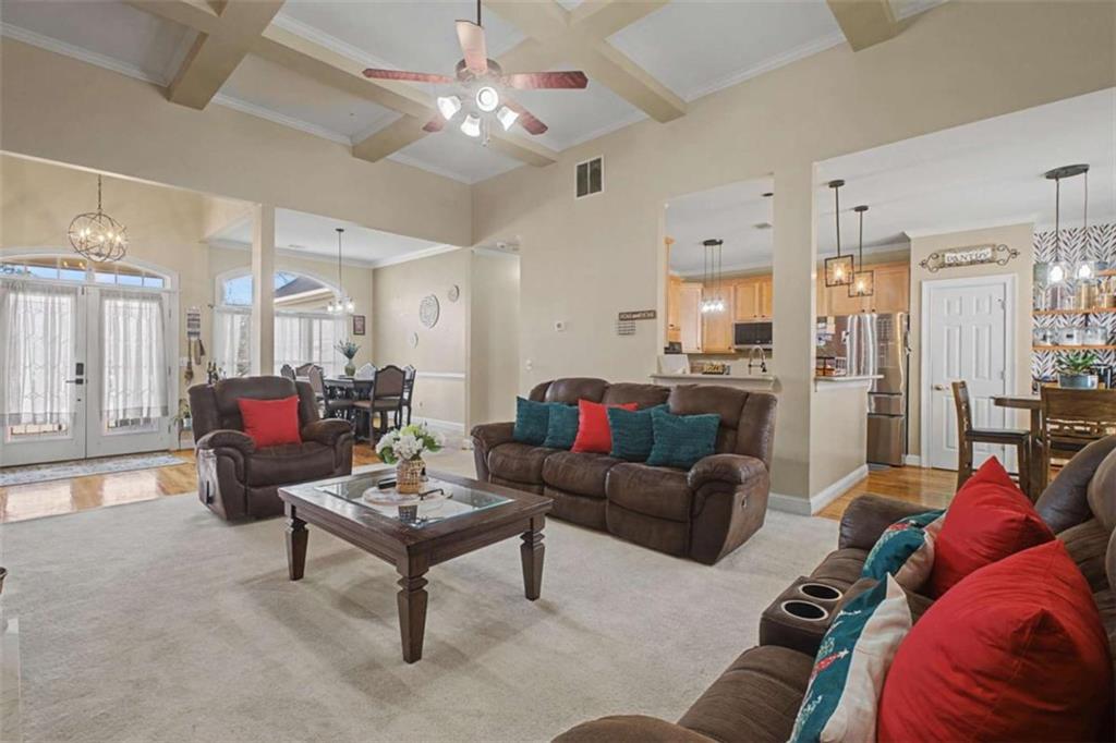 9620 Coastal Pointe Drive Villa Rica, GA 30180 - Photo 14 of 65 a living room with furniture kitchen view and a chandelier