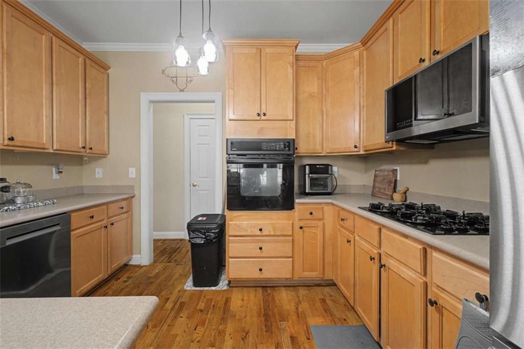 9620 Coastal Pointe Drive Villa Rica, GA 30180 - Photo 21 of 65 a kitchen with stainless steel appliances granite countertop a stove sink and cabinets