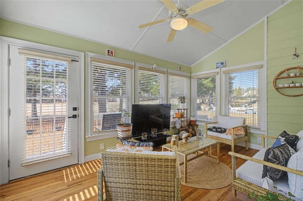 9620 Coastal Pointe Drive Villa Rica, GA 30180 - Photo 26 of 65 a living room with furniture a flat screen tv and large window