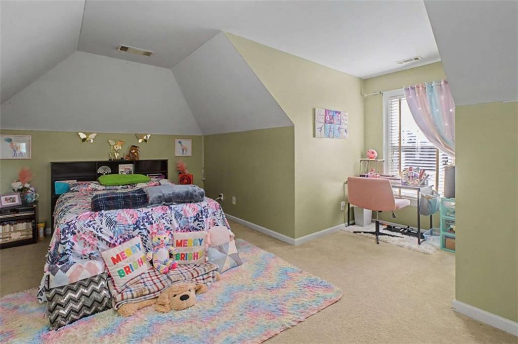 9620 Coastal Pointe Drive Villa Rica, GA 30180 - Photo 42 of 65 a bedroom with a bed and a dresser in it