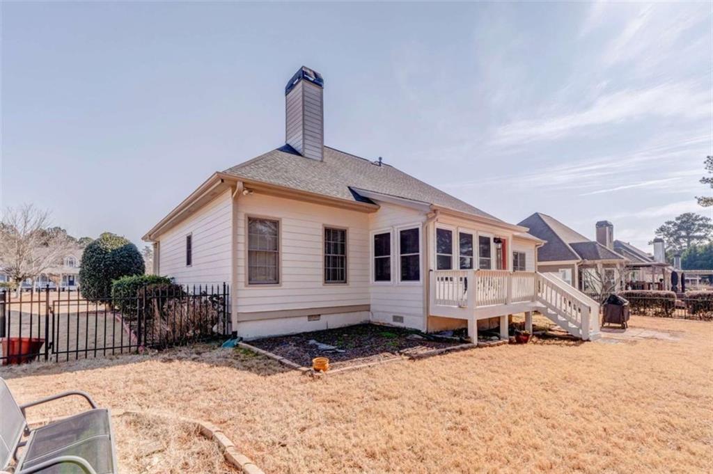 9620 Coastal Pointe Drive Villa Rica, GA 30180 - Photo 58 of 65 a front view of a house with a yard covered in snow