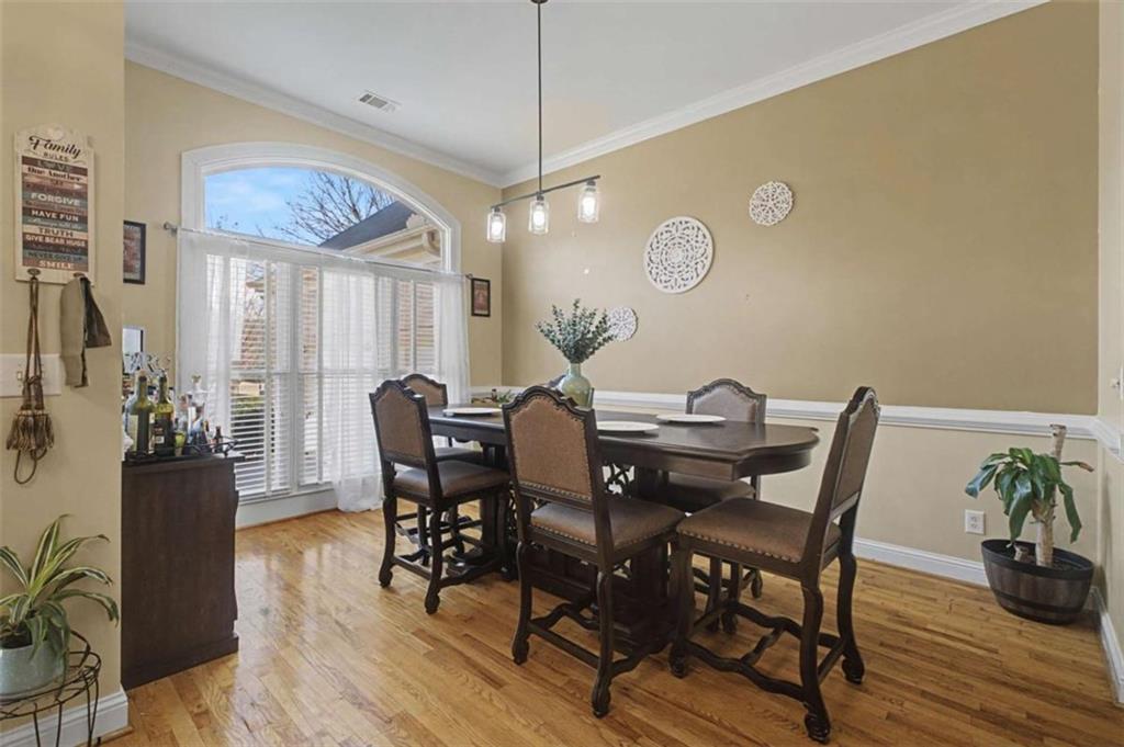 9620 Coastal Pointe Drive Villa Rica, GA 30180 - Photo 7 of 65 a view of a dining room with furniture and wooden floor