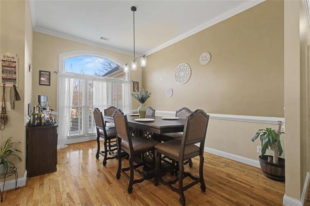 9620 Coastal Pointe Drive Villa Rica, GA 30180 - Photo 9 of 65 a view of a dining room with furniture wooden floor and chandelier