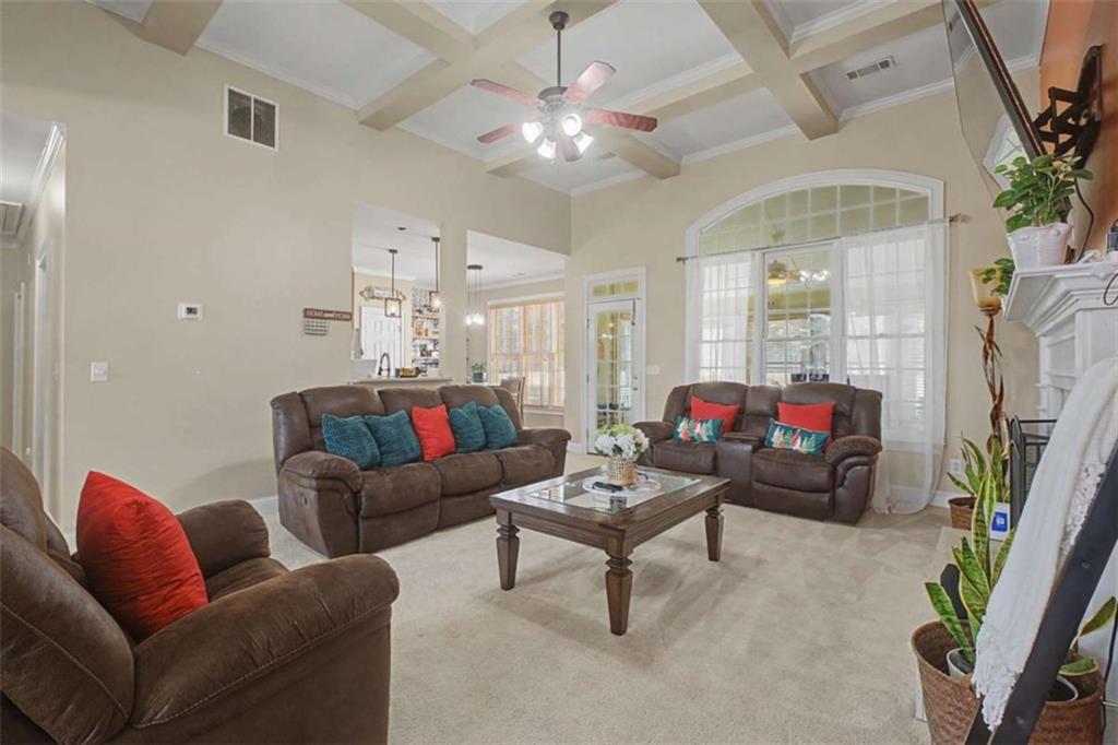 9620 Coastal Pointe Drive Villa Rica, GA 30180 - Photo 10 of 65 a living room with furniture and a chandelier