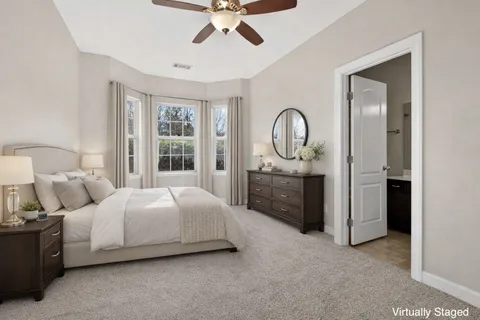 a bedroom with bed and window