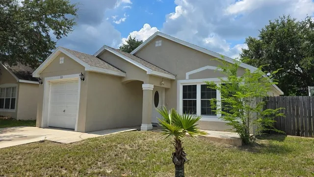 a house view with a backyard space