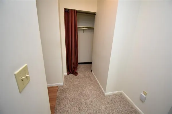 a view of a hallway with closet