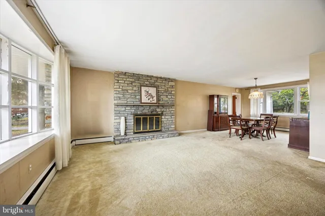 a view of a livingroom with furniture and a fireplace