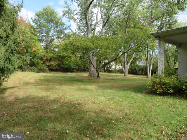 a view of a yard with swimming pool