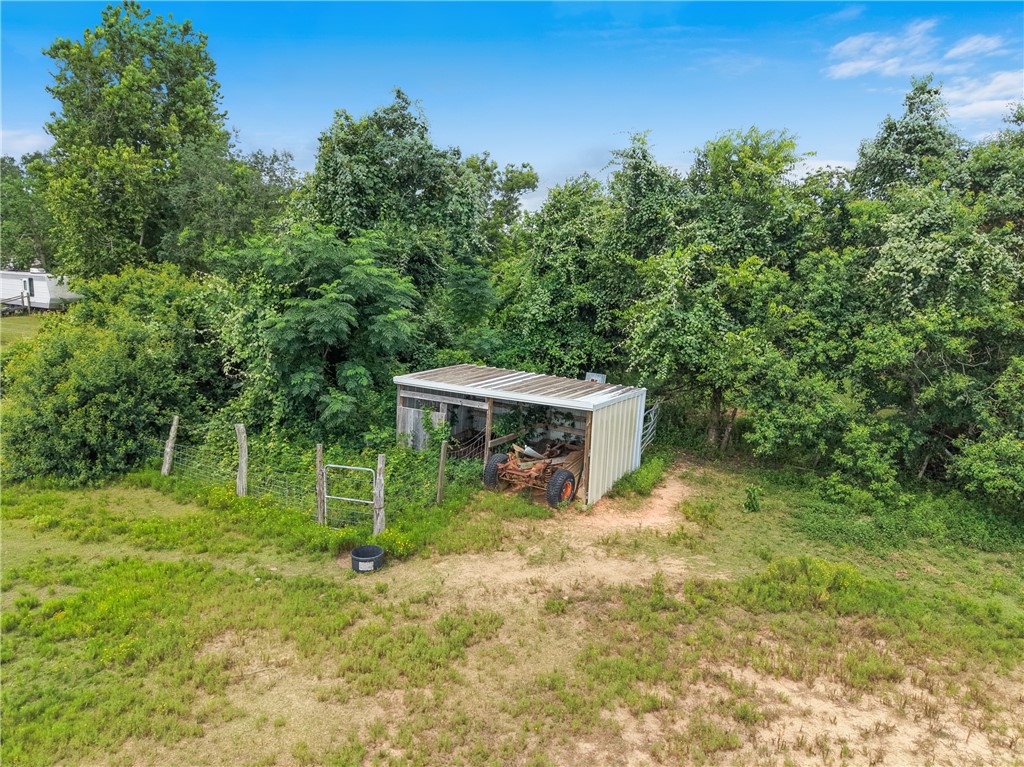 34366 Owens Road Hempstead, TX 77445 - Photo 25 of 31 a view of a tiny house with yard and sitting area