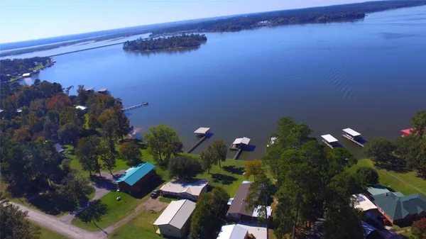 a view of a house with a yard and garden