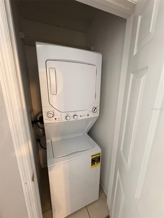 10106 Regent Square Drive, Unit 209 Orlando, FL 32825 - Photo 11 of 19 a utility room with dryer and washer