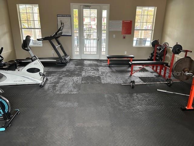 10106 Regent Square Drive, Unit 209 Orlando, FL 32825 - Photo 15 of 19 a view of a room with gym equipment