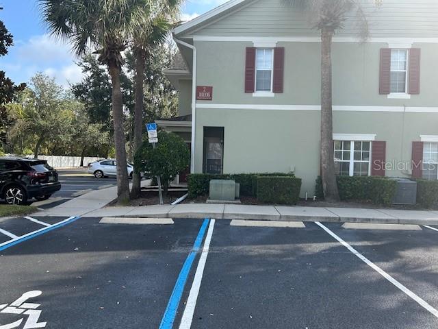 10106 Regent Square Drive, Unit 209 Orlando, FL 32825 - Photo 18 of 19 a view of a street with houses