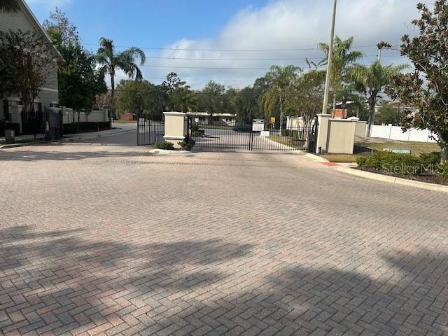 10106 Regent Square Drive, Unit 209 Orlando, FL 32825 - Photo 19 of 19 a swimming pool with outdoor seating and trees
