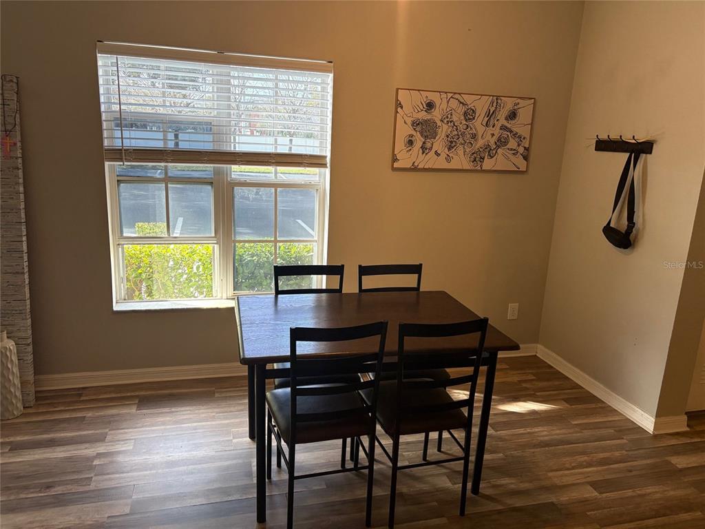 10106 Regent Square Drive, Unit 209 Orlando, FL 32825 - Photo 6 of 19 a view of a workspace with furniture and window