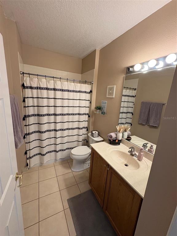 10106 Regent Square Drive, Unit 209 Orlando, FL 32825 - Photo 10 of 19 a bathroom with a sink toilet and shower