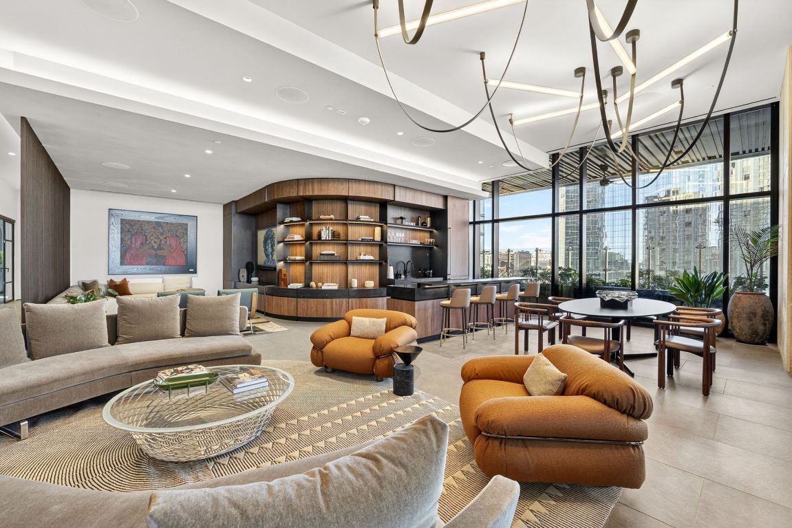 610 Davis Street, Unit 5001 Austin, TX 78701 - Photo 25 of 38 a living room with furniture a rug and a large window