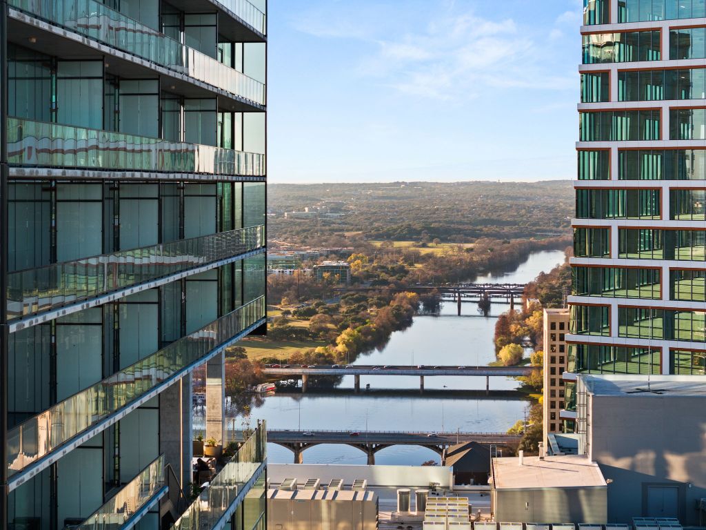 610 Davis Street, Unit 5001 Austin, TX 78701 - Photo 35 of 38 a view of a balcony with two chairs and a table