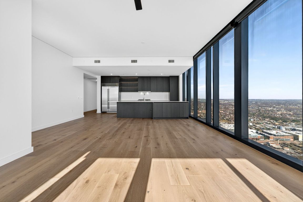 610 Davis Street, Unit 5001 Austin, TX 78701 - Photo 8 of 38 a view of kitchen with granite countertop window and wooden floor
