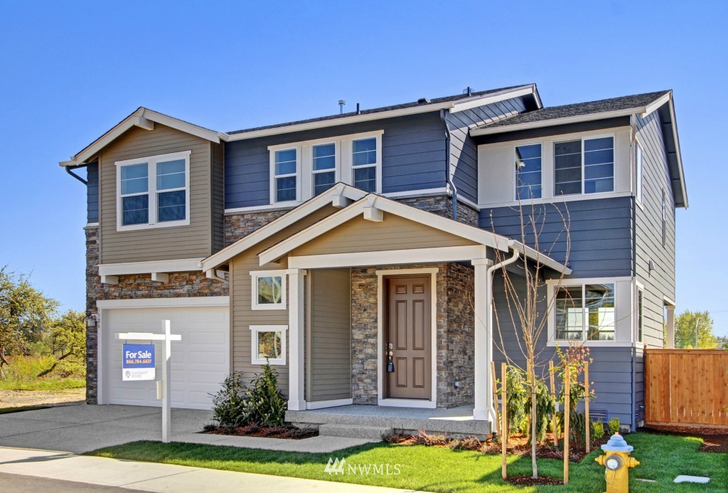 3526 178th Place Southeast, Unit 3012 Bothell, WA 98012 - Photo 1 of 20 a front view of a house with a yard