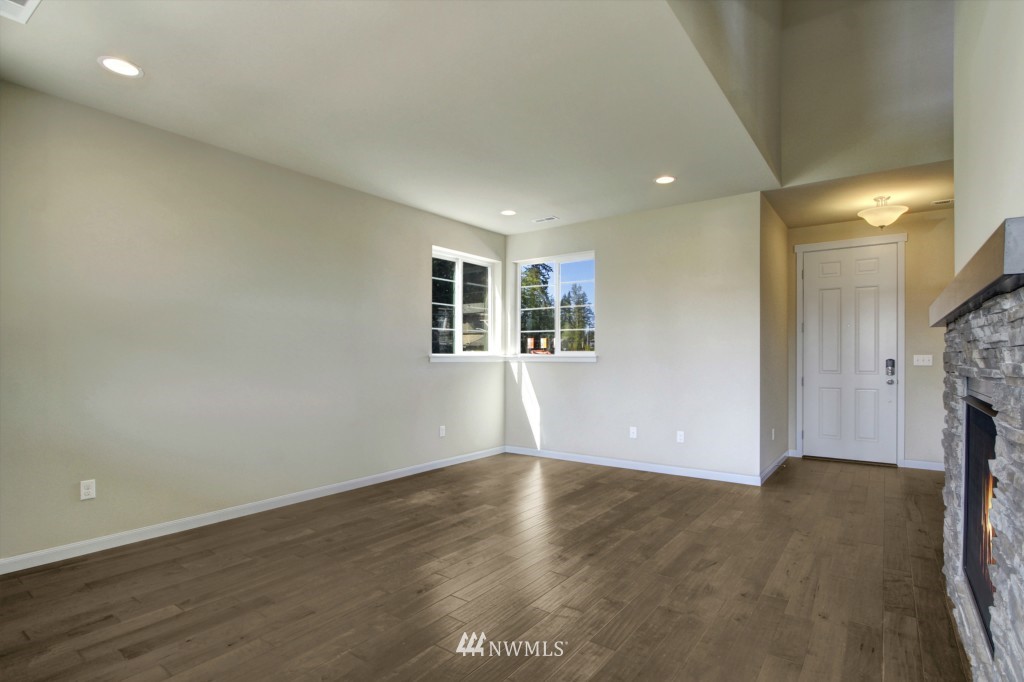 3526 178th Place Southeast, Unit 3012 Bothell, WA 98012 - Photo 8 of 20 wooden floor in an empty room with a window