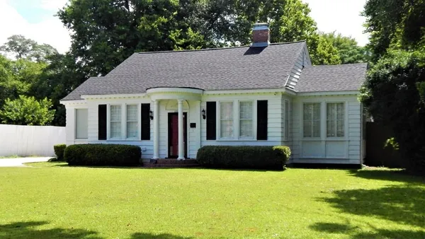a house view with a garden space