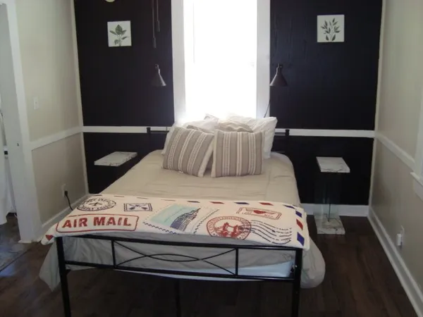 a bedroom with a bed and a table