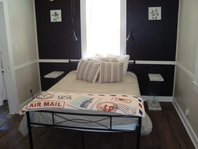 a bedroom with a bed and a table