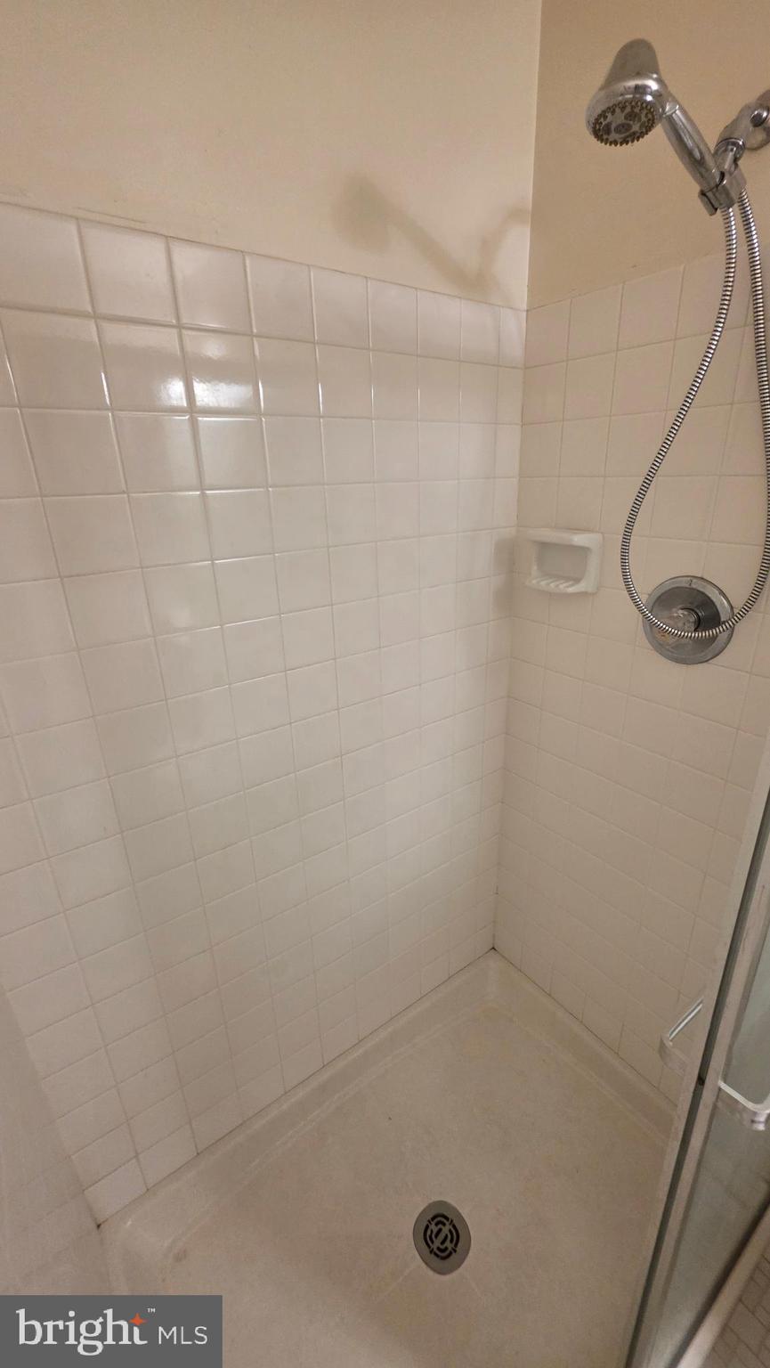 3928 Rolling Rd., Unit C10 Pikesville, MD 21208 - Photo 13 of 26 a bathroom with a shower