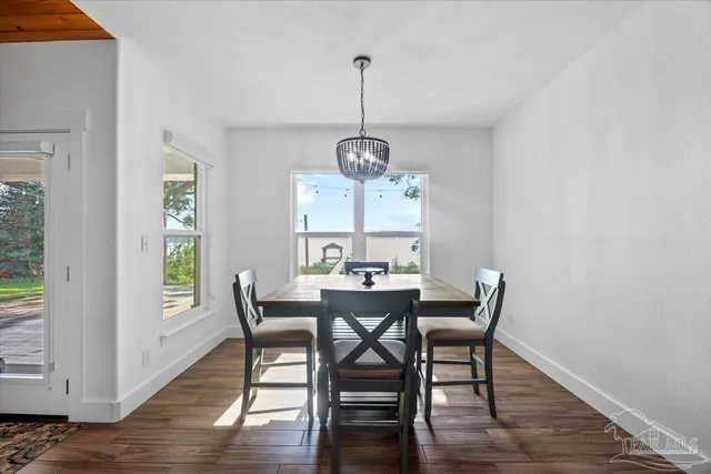 a kitchen with stainless steel appliances a sink a refrigerator a stove a microwave and island