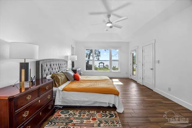 a bedroom with a bed and a view of bedroom