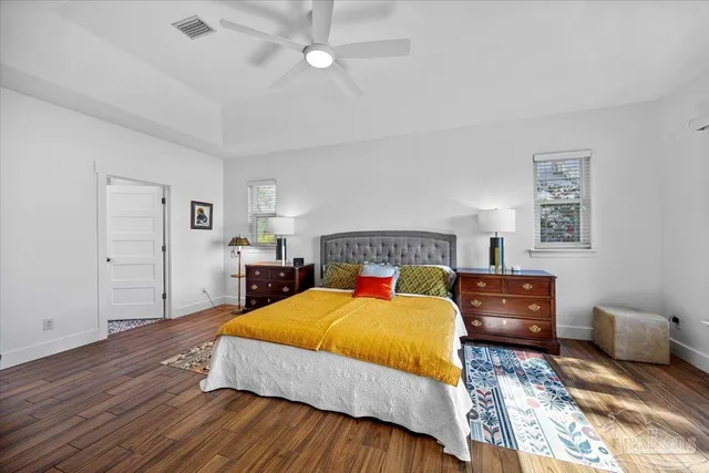 a bathroom with a sink mirror vanity and toilet