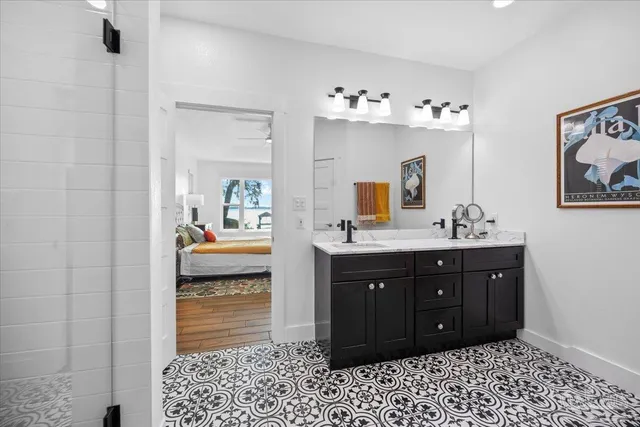 a bedroom with bed and window