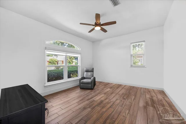 a view of pool with a yard