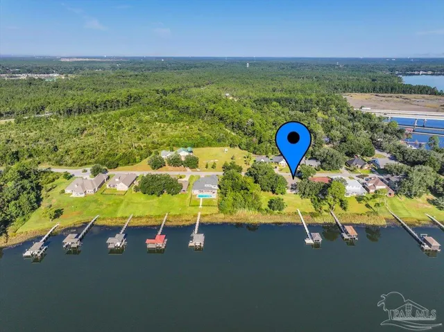 a view of a backyard with potted plants