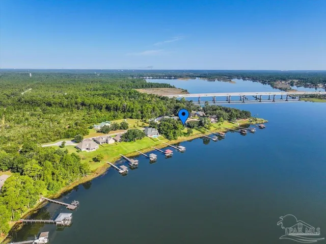 a view of yard with swimming pool and trees