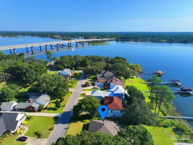 a view of yard with swimming pool and green space