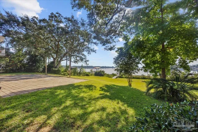 a view of a lake with a yard