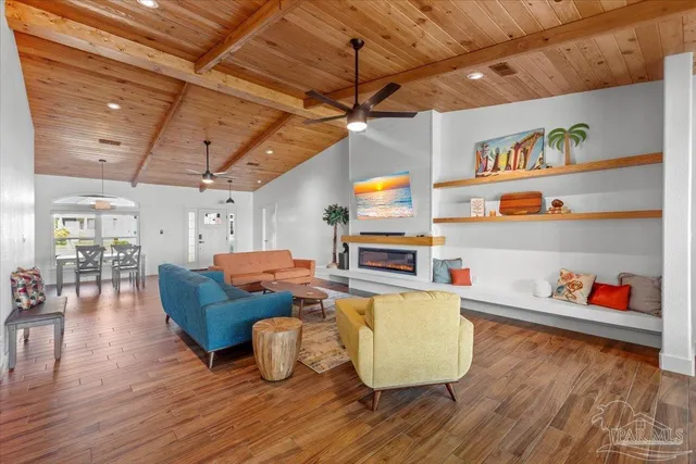 a view of a dining room with furniture and wooden floor