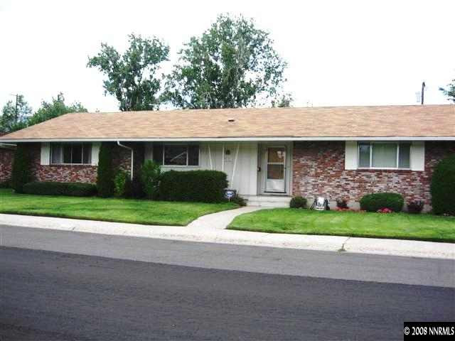 1965 Wren Street Reno, NV 89509 - Photo 1 of 9 a front view of a house with a garden and plants