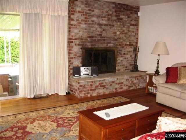 1965 Wren Street Reno, NV 89509 - Photo 3 of 9 a living room with furniture and a fireplace