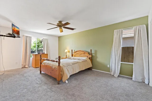 a bed room with a bed and a chandelier