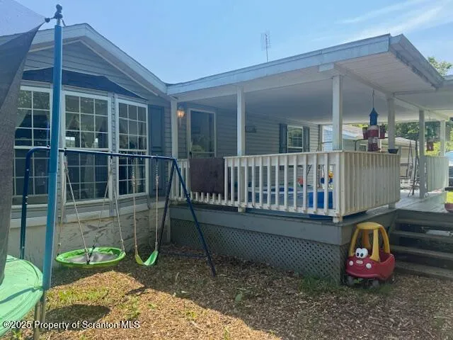 a view of a chair and tables in the patio